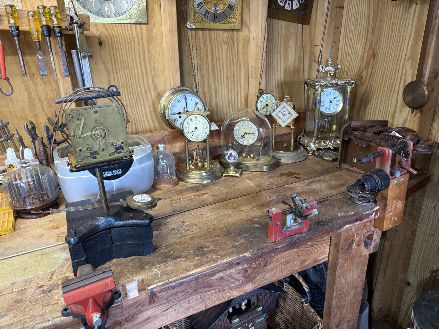 Harold’s workbench lined with antique clock movements and hand tools